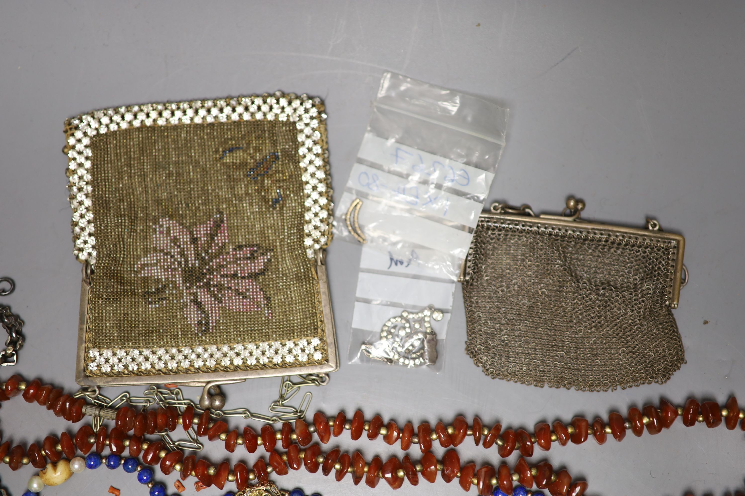 Mixed costume jewellery, two evening bags and a white metal albertina.